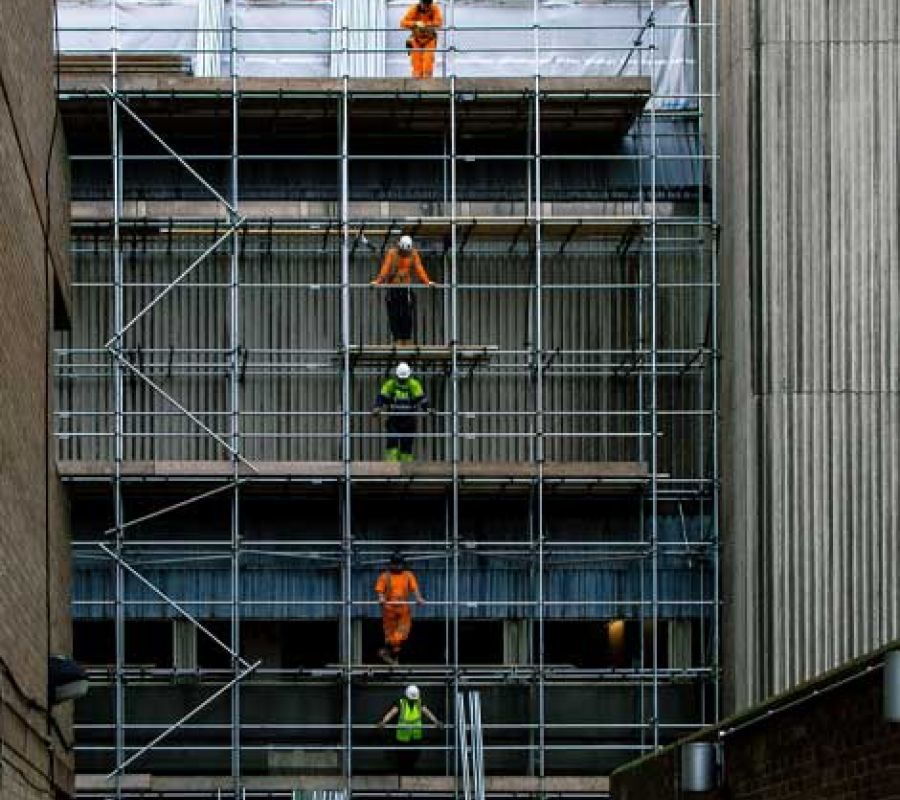 Workers on a scaffolding building