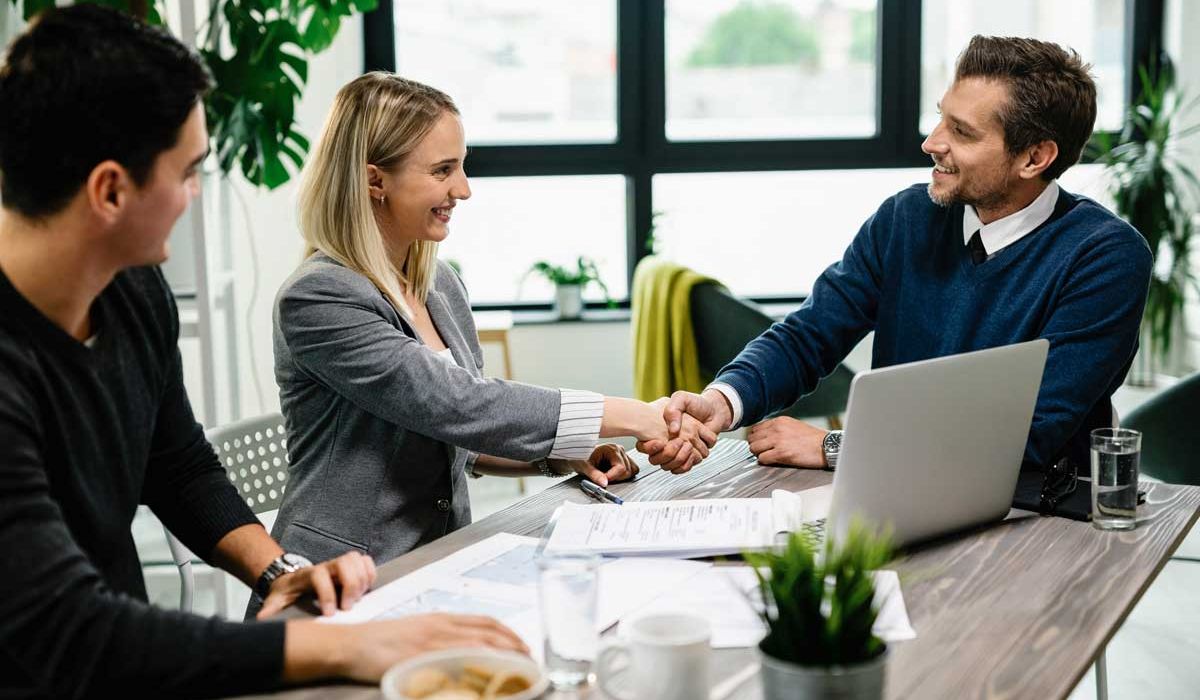 Young happy couple meeting with a financial advisor