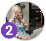 Happy woman checking laptop