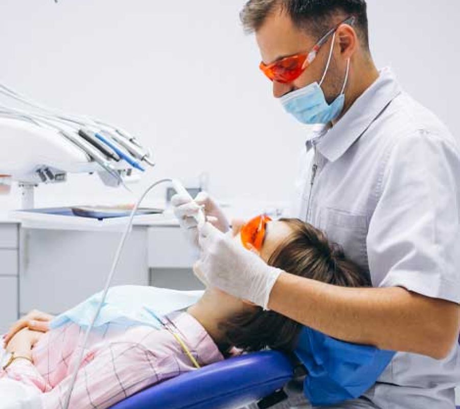 A dentist working on a patient
