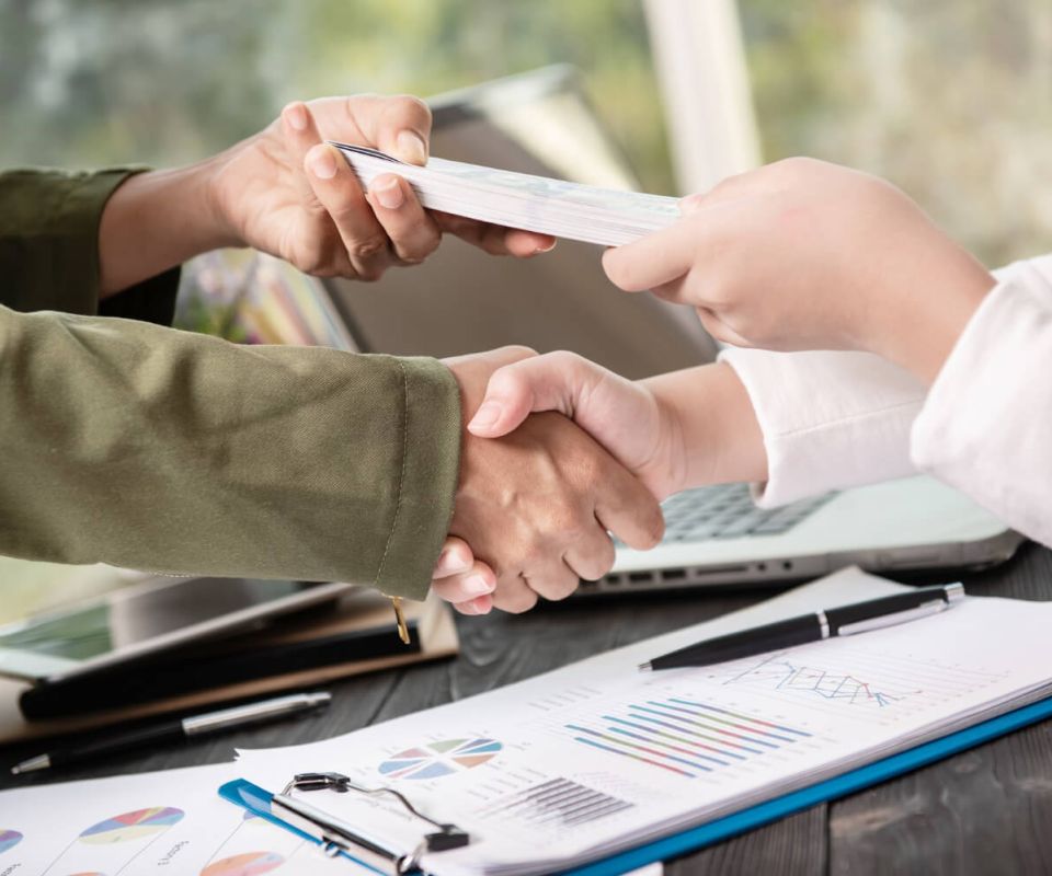 Business people shaking hands, finishing up meeting