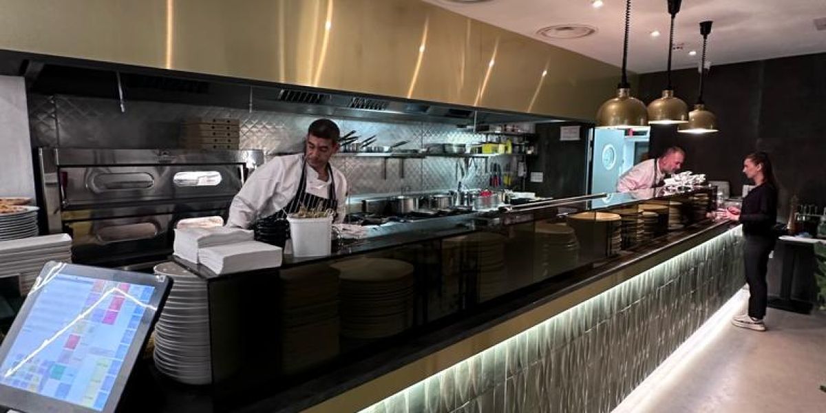 Open kitchen restaurant with chefs working