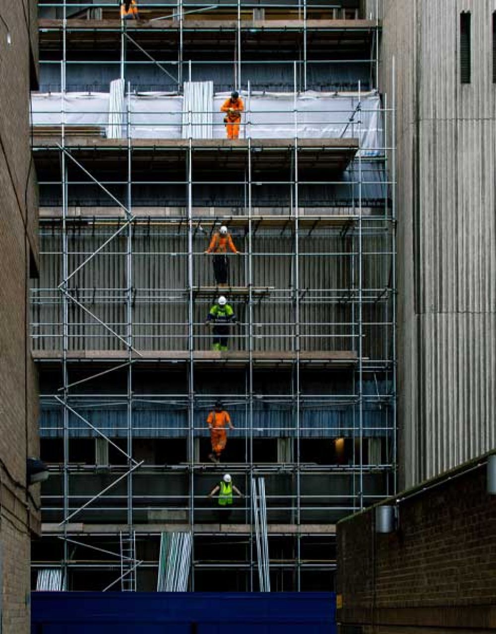 Workers on a scaffolding building